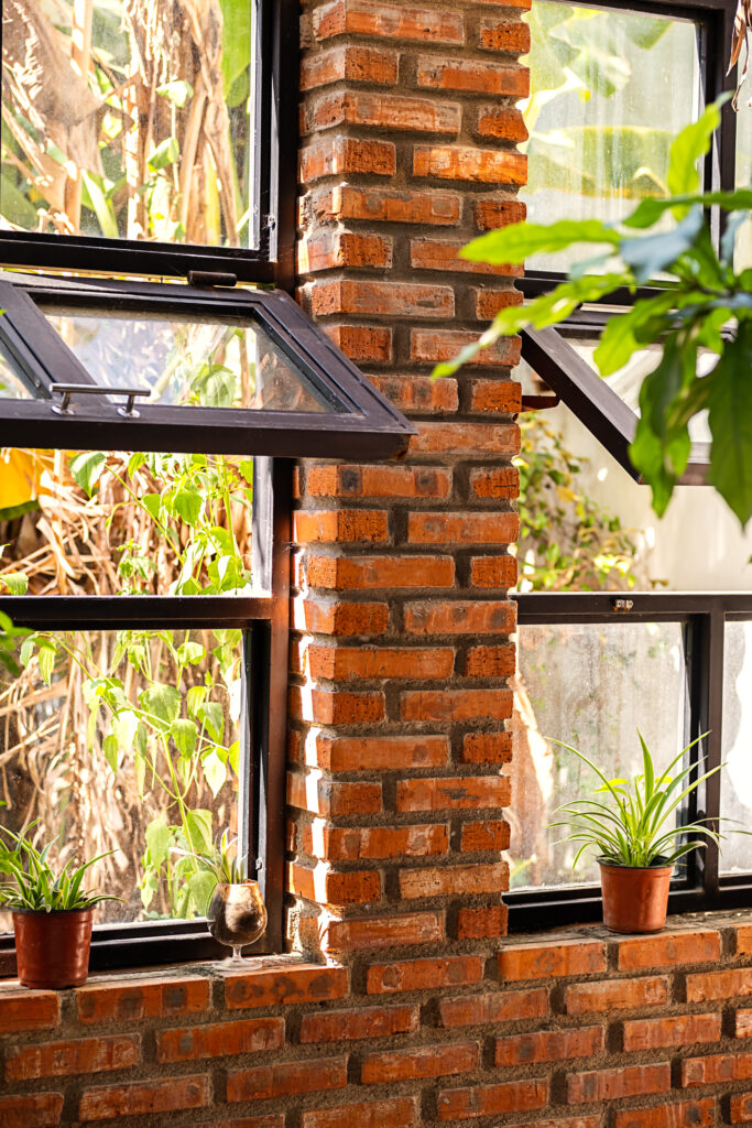 Modern workshop with big awning windows philadelphia pa and indoor garden. Landscaped coworking space.
