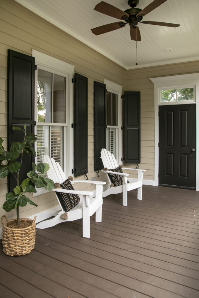 porch with chairs and entry door on southern home