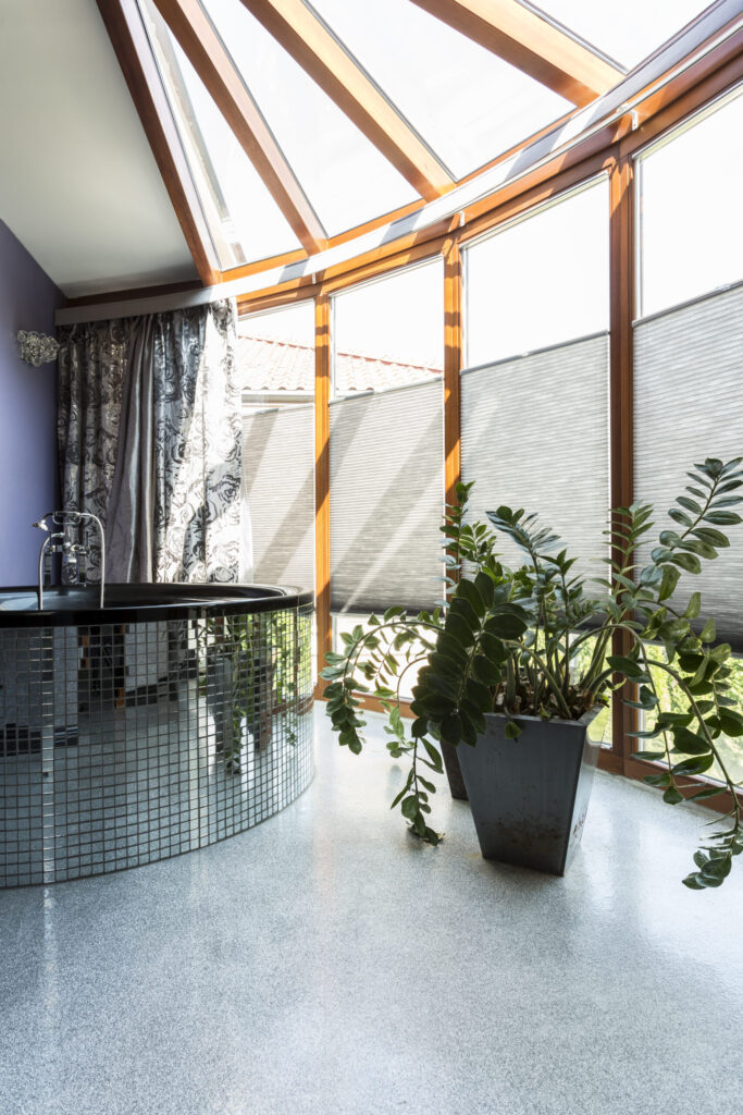 Sophisticated silver bathroom with large windows